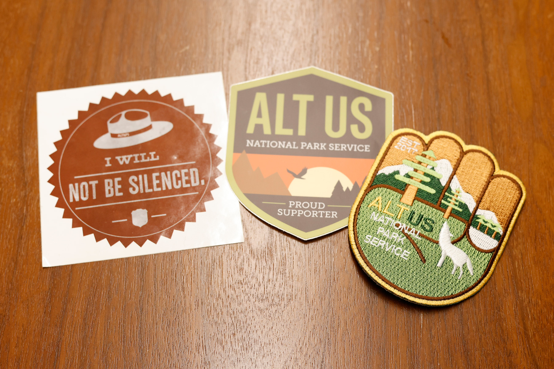 Stickers and iron-on patches supporting the Alt National Park Service